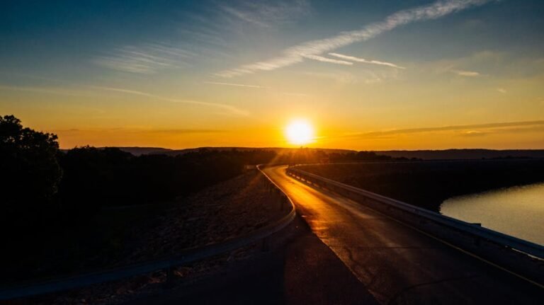 Scenic sunset view along a winding road near water in Chattanooga, Tennessee.