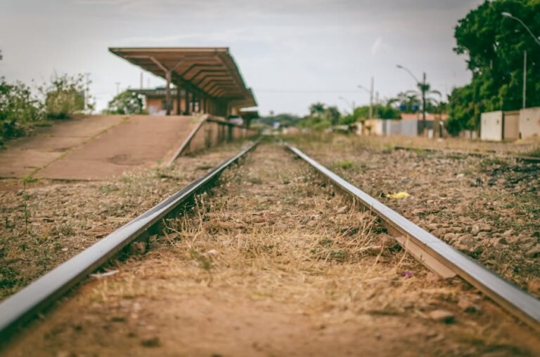 A deserted railway line leading to a rustic station in Bras&iacute;lia, Brazil.