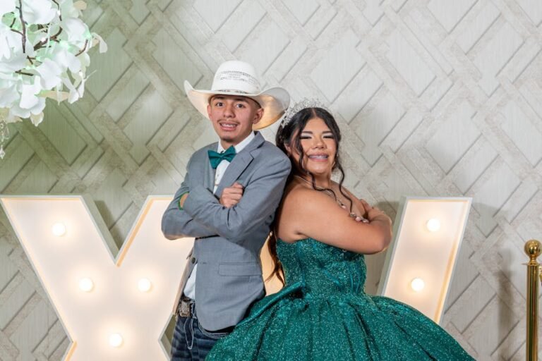 Portrait of a young couple dressed for a quinceañera festivity indoors.